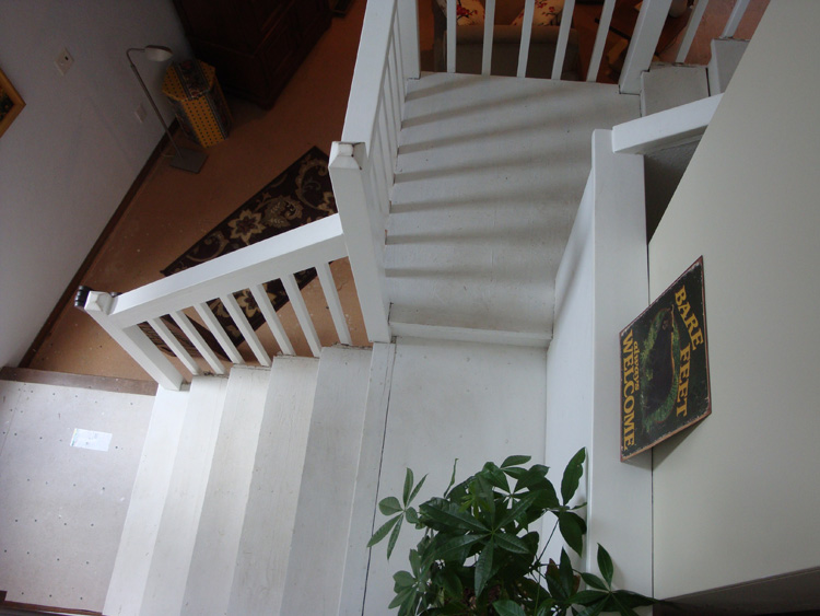 BEFORE: Additional view of the original staircase at the Columbia River home.