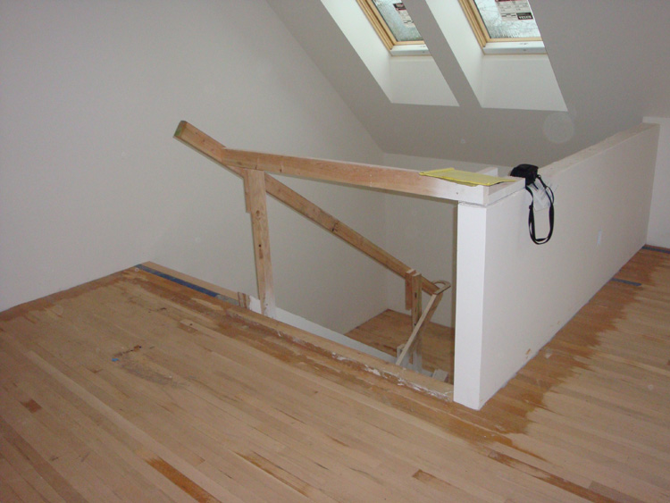 BEFORE: Original staircase before the remodel at the NW Portland home.