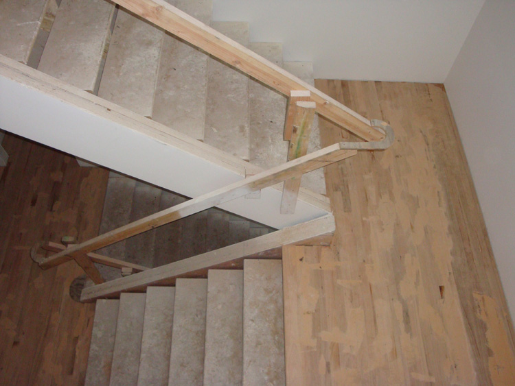 BEFORE: Additional view of the original staircase at the NW Portland home.