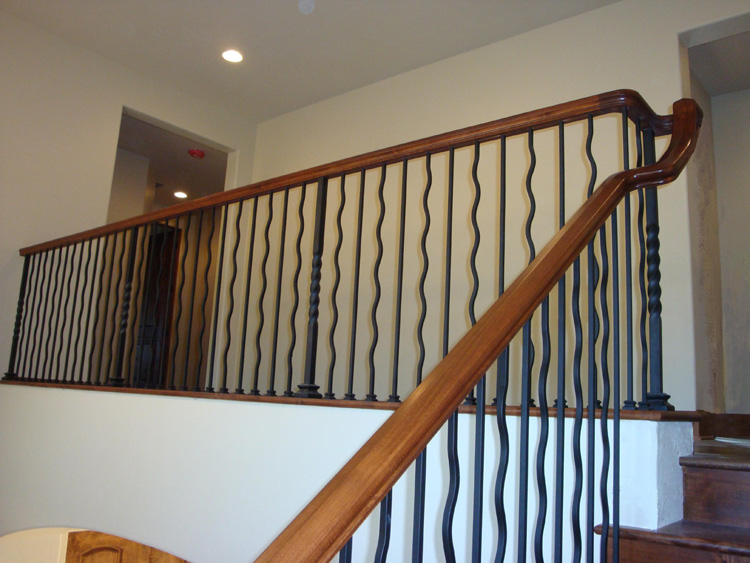 AFTER: Finished staircase with hand-inlaid horseshoe details at the Mt. Pleasant home.