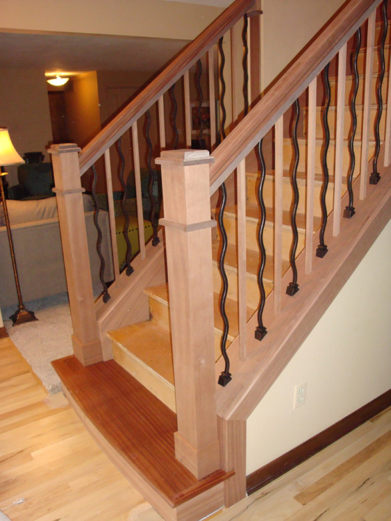 AFTER: Finished staircase with custom wood and iron spindles at the Vancouver home.